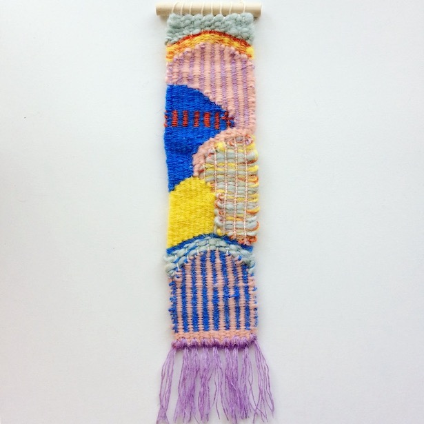 Narrow, rectangular weaving, inspired by rolling hills at sunrise. In yellow, pink, seafoam, lilac, blue and orange.